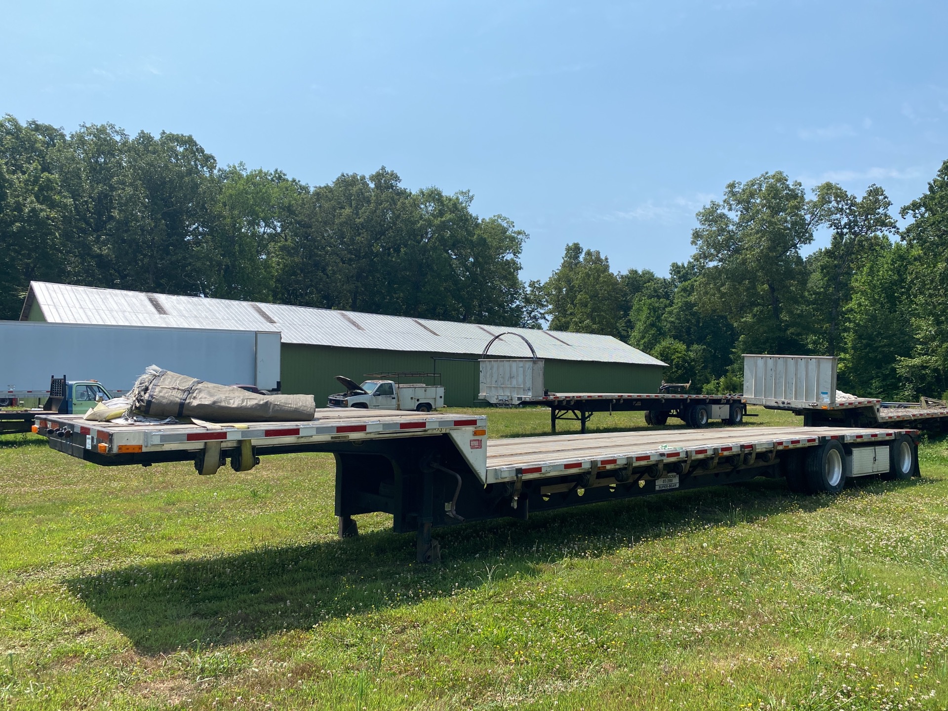 2000 Transcraft 48 ft T/A Spread Axle Single Drop Step Deck Trailer